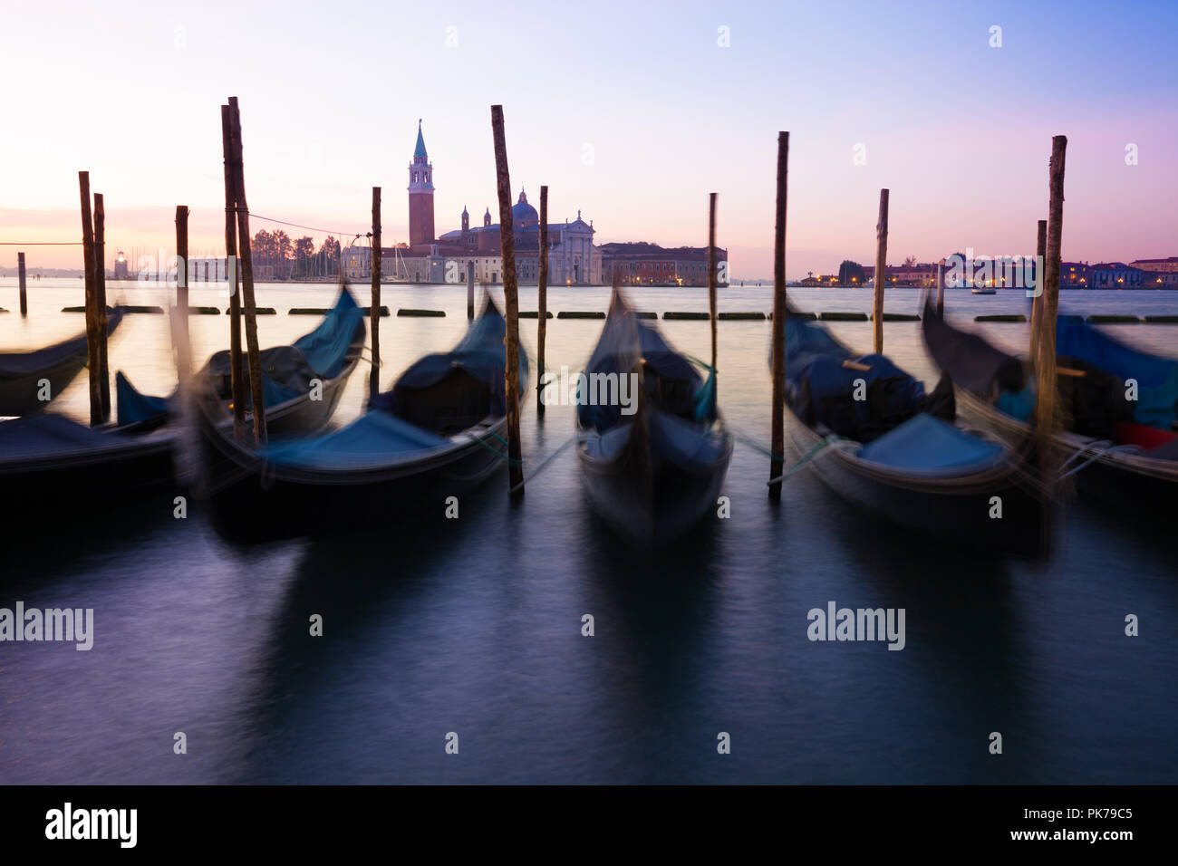 Venice classic view with famous gondolas at sunrise, Italy Stock Photo ...