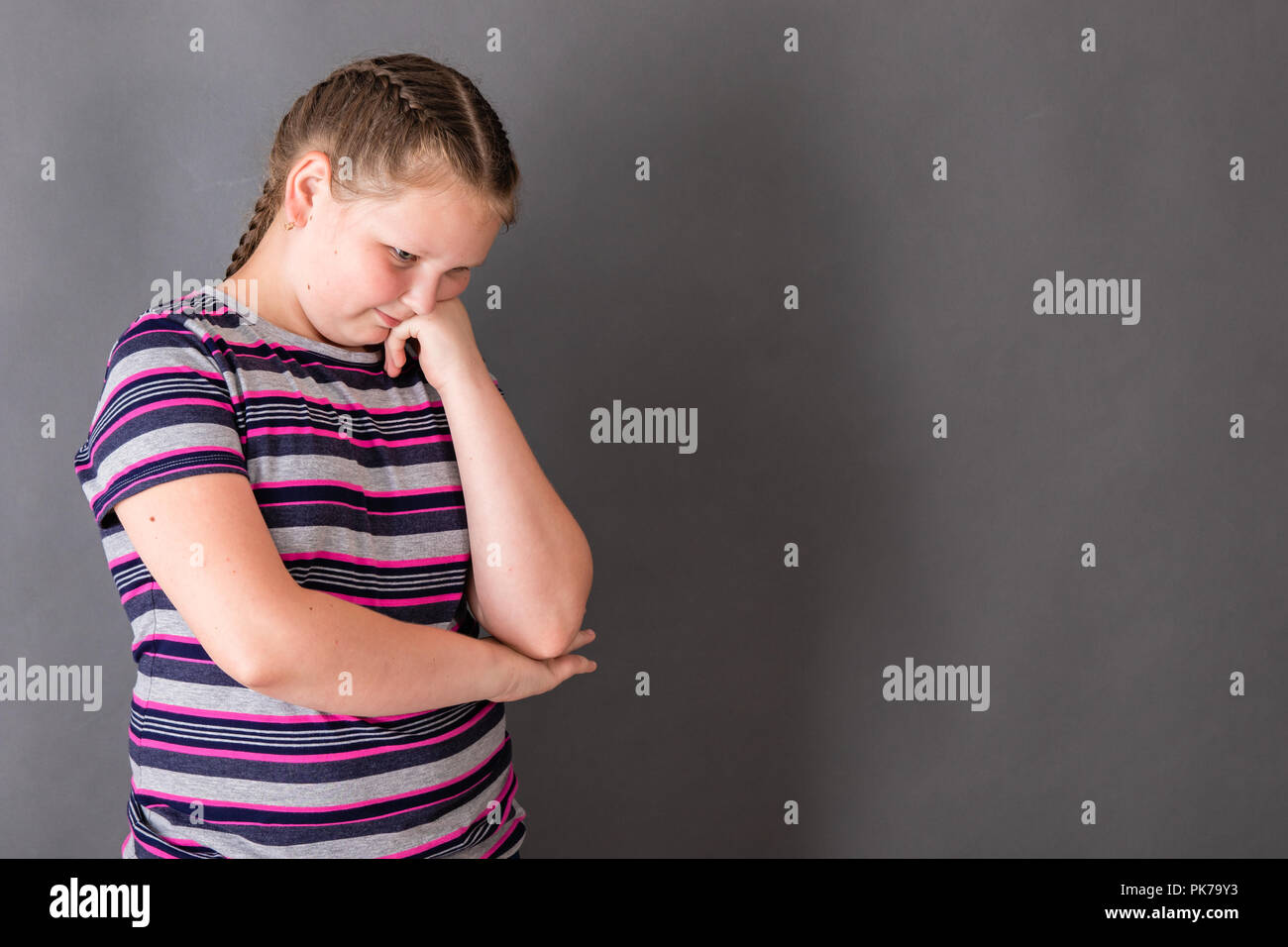 Young chubby teenage girl wear on red dress and jeans jacket posed against  school backyard Stock Photo - Alamy