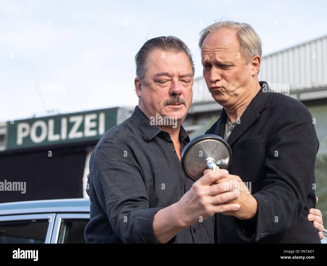 Friedberg, Hessen. 11th Sep, 2018. Actors Peter Kurth (l) and Ulrich Tukur are on the edge of the shooting for a new crime scene of Hessian Radio (HR). The eighth HR crime scene with Ulrich Tukur is created under the working title "The Attack". Credit: Frank Rumpenhorst/dpa/Alamy Live News Stock Photo