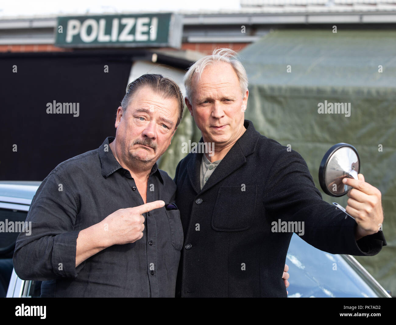 Friedberg, Hessen. 11th Sep, 2018. Actors Peter Kurth (l) and Ulrich Tukur are on the edge of the shooting for a new crime scene of Hessian Radio (HR). The eighth HR crime scene with Ulrich Tukur is created under the working title 'The Attack'. Credit: Frank Rumpenhorst/dpa/Alamy Live News Stock Photo