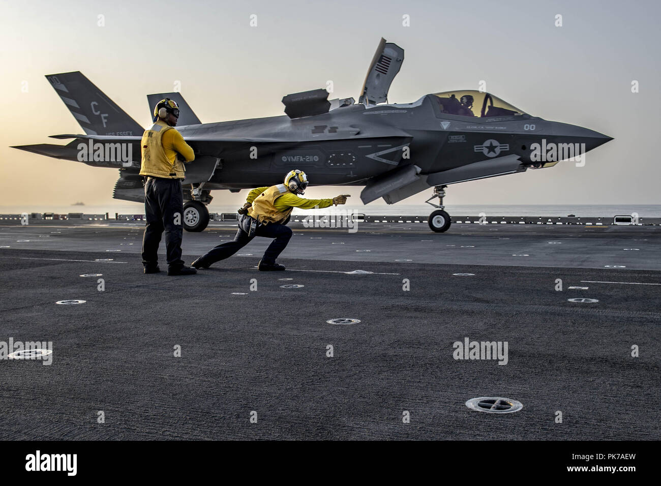 March 8, 2018 - GULF OF ADEN - GULF OF ADEN (Sept. 7, 2018) Aviation Boatswainâ€™s Mate (Handling) 1st Class Francis Centeno launches an F-35B Lightning II attached to the â€œAvengersâ€ of Marine Fighter Attack Squadron (VMFA) 211 from the flight deck of Wasp-class amphibious assault ship USS Essex (LHD 2). Essex is on a scheduled deployment of the Essex Amphibious Ready Group (ARG) and 13th Marine Expeditionary Unit (MEU). The Essex ARG and 13th MEU is the first U.S. Navy/Marine Corps team to deploy to U.S. 5th Fleet area of operations with the transformational warfighting capabilities of th Stock Photo