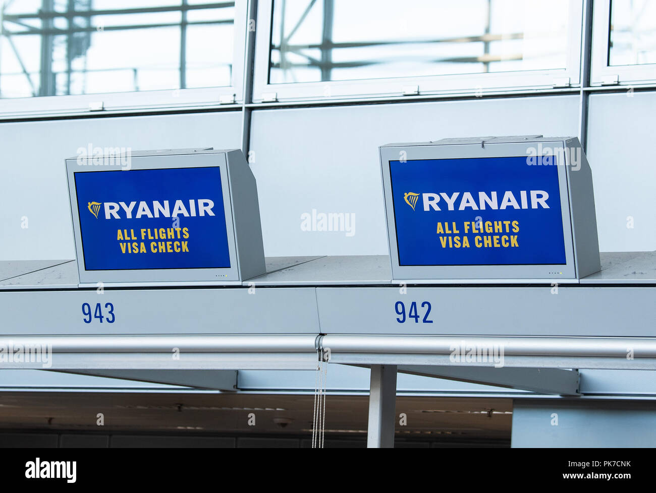11 September 2018, Hessen, Frankfurt/Main: Irish airline Ryanair logos are  displayed on monitors at the check-in counter in Terminal 2 of the airport.  Verdi and the pilot union Vereinigung Cockpit (VC) call