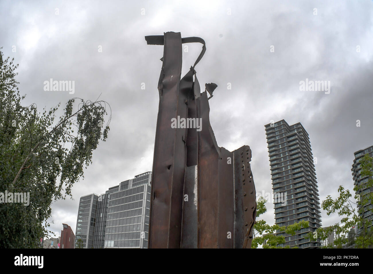 911 steel beam structure In The Olympic Park, London, UK. 11th September 2018. The 911 steel beam structure a Memorial In The Olympic Park. A memories of September 11, 2001 attack of 3,000 death. The world never is the same again 17 years later from Al Qaeda ’s to Taliban, IS, Daesh to ISIS? or regimes change? logic seven largely Muslim countries (Afghanistan, Iraq, Libya, Pakistan, Somalia, Syria, and Yemen) none of them has any link to the 9/11 attacks? and destroyed 20 million Arabs/Muslim killed and over 65 millions refugees?. Who is our real enemy of mankind, an enemy of humanity? shouldn Stock Photo