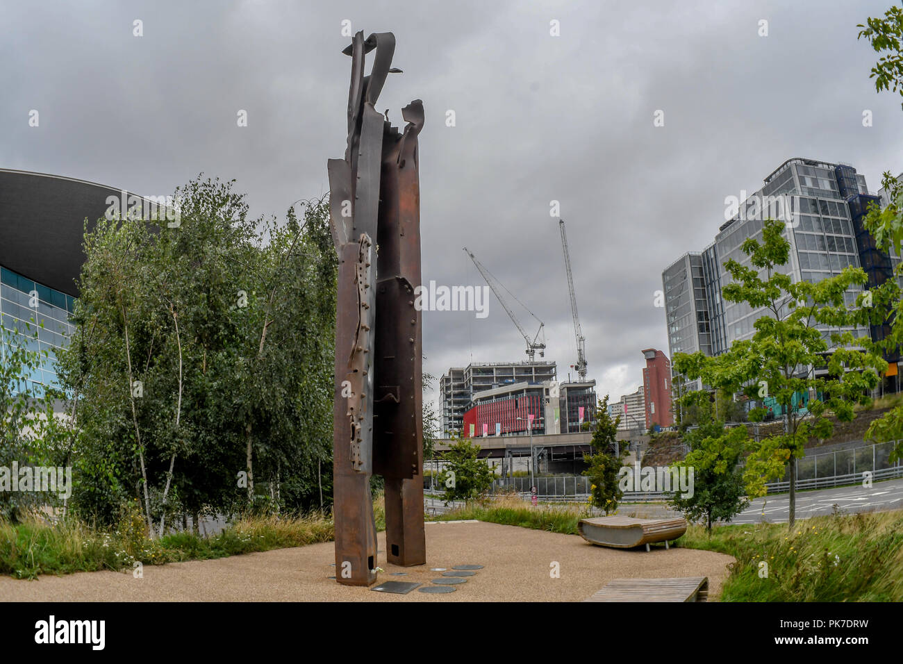 911 steel beam structure In The Olympic Park, London, UK. 11th September 2018. The 911 steel beam structure a Memorial In The Olympic Park. A memories of September 11, 2001 attack of 3,000 death. The world never is the same again 17 years later from Al Qaeda ’s to Taliban, IS, Daesh to ISIS? or regimes change? logic seven largely Muslim countries (Afghanistan, Iraq, Libya, Pakistan, Somalia, Syria, and Yemen) none of them has any link to the 9/11 attacks? and destroyed 20 million Arabs/Muslim killed and over 65 millions refugees?. Who is our real enemy of mankind, an enemy of humanity? shouldn Stock Photo