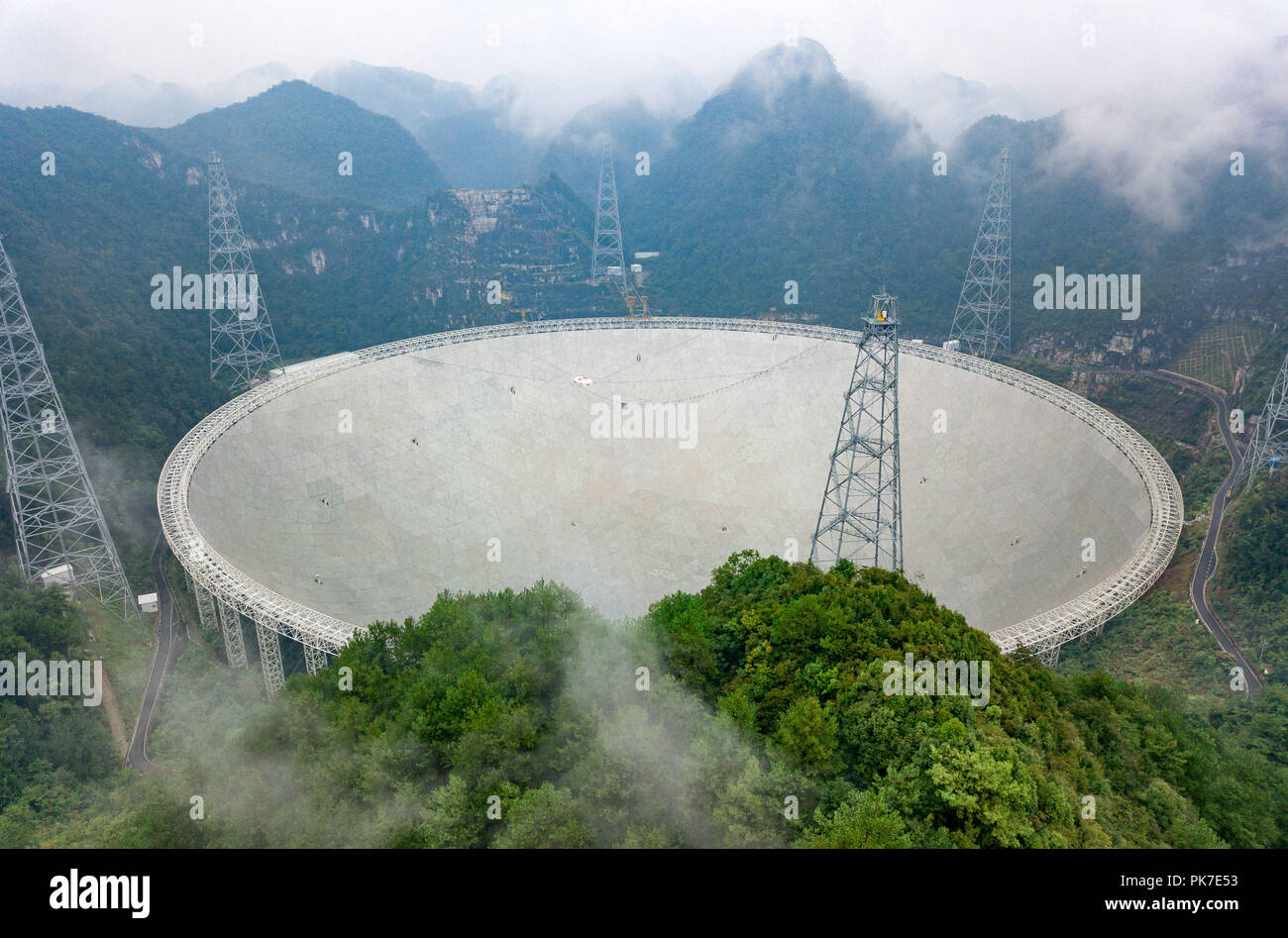 Pingtang. 11th Sep, 2018. Photo taken on Sept. 11, 2018 shows China's Five-hundred-meter Aperture Spherical Radio Telescope (FAST) in southwest China's Guizhou Province. FAST has discovered 44 new pulsars so far. Credit: Liu Xu/Xinhua/Alamy Live News Stock Photo