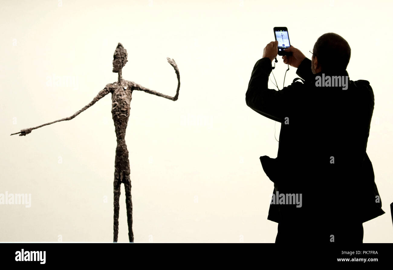 Alberto giacometti man pointing hi-res stock photography and images - Alamy