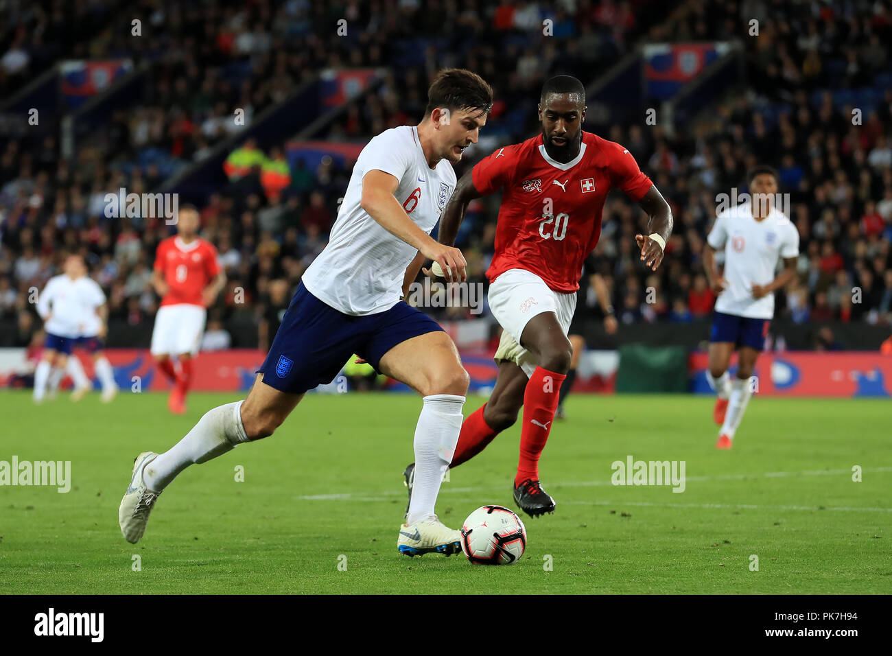 King Power Stadium, Leicester, UK. 11th Sep, 2018. International Football Friendly, England versus Switzerland; Harry Maguire of England competes for the ball with Johan Djourou of Switzerland Credit: Action Plus Sports/Alamy Live News Stock Photo