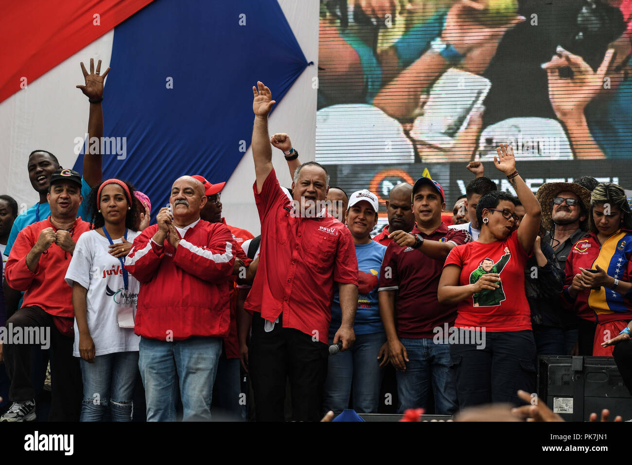 Caracas, Distrito Capital, Venezuela. 11th Sep, 2018. Diosdado Cabello alongside party members seen raising their arms during the rally.March called by the vice president of the United Socialist Party of Venezuela (PSUV), Diosdado Cabello, against the accusations and investigations made by the US government to political leaders of President Maduro's administration. Credit: Roman Camacho/SOPA Images/ZUMA Wire/Alamy Live News Stock Photo