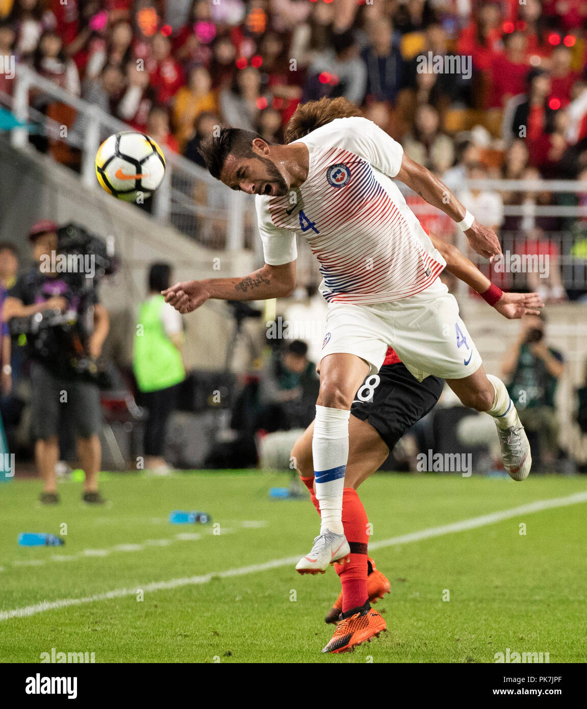 Suwon, South Korea. 11th Sep, 2018. Mauricio Isla (Front) of Chile heads for the ball during a friendly soccer match between South Korea and Chile at Suwon World Cup Stadium in Suwon, South Korea, on Sept. 11, 2018. The match ended with a 0-0 draw. Credit: Lee Sang-ho/Xinhua/Alamy Live News Stock Photo