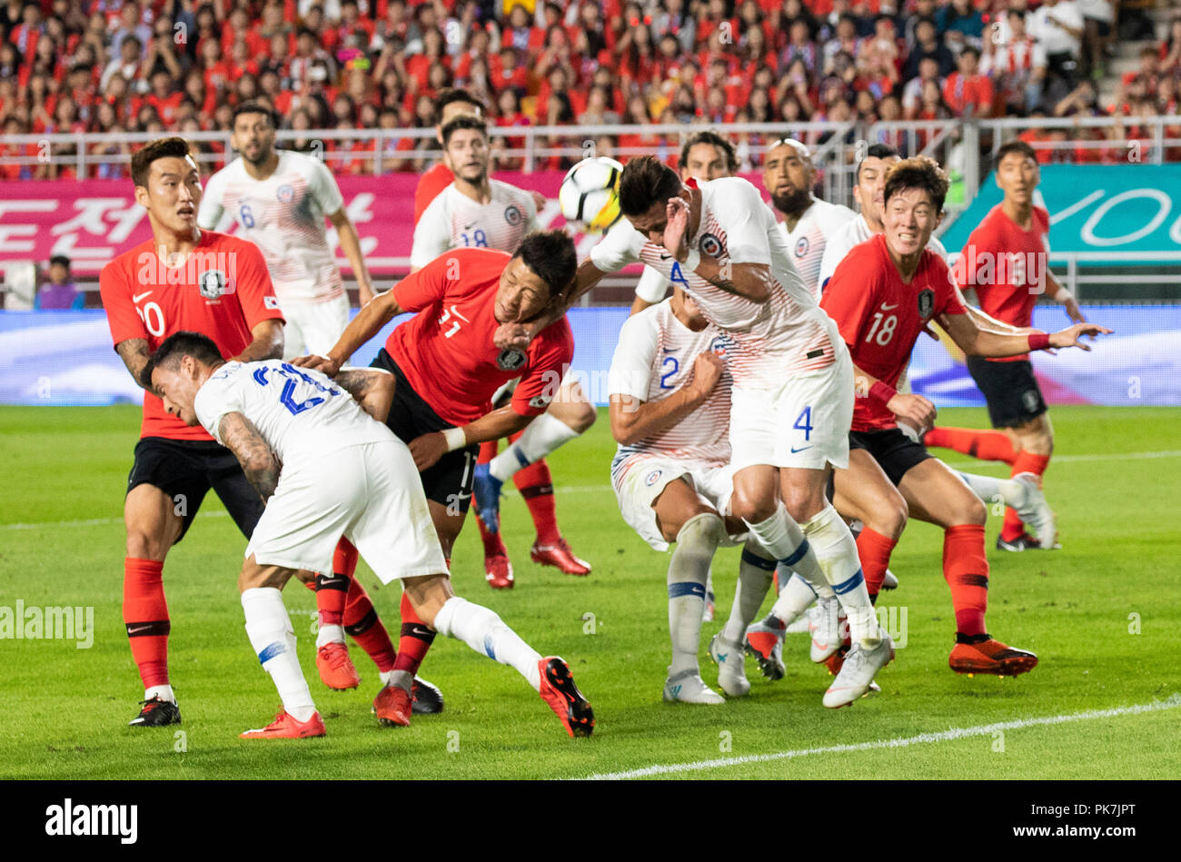 Suwon, South Korea. 11th Sep, 2018. Hwang Hee-chan (front 3rd L) of South Korea vies with Chile's Mauricio Isla (front 1st R) during a friendly soccer match between South Korea and Chile at Suwon World Cup Stadium in Suwon, South Korea, on Sept. 11, 2018. The match ended with a 0-0 draw. Credit: Lee Sang-ho/Xinhua/Alamy Live News Stock Photo