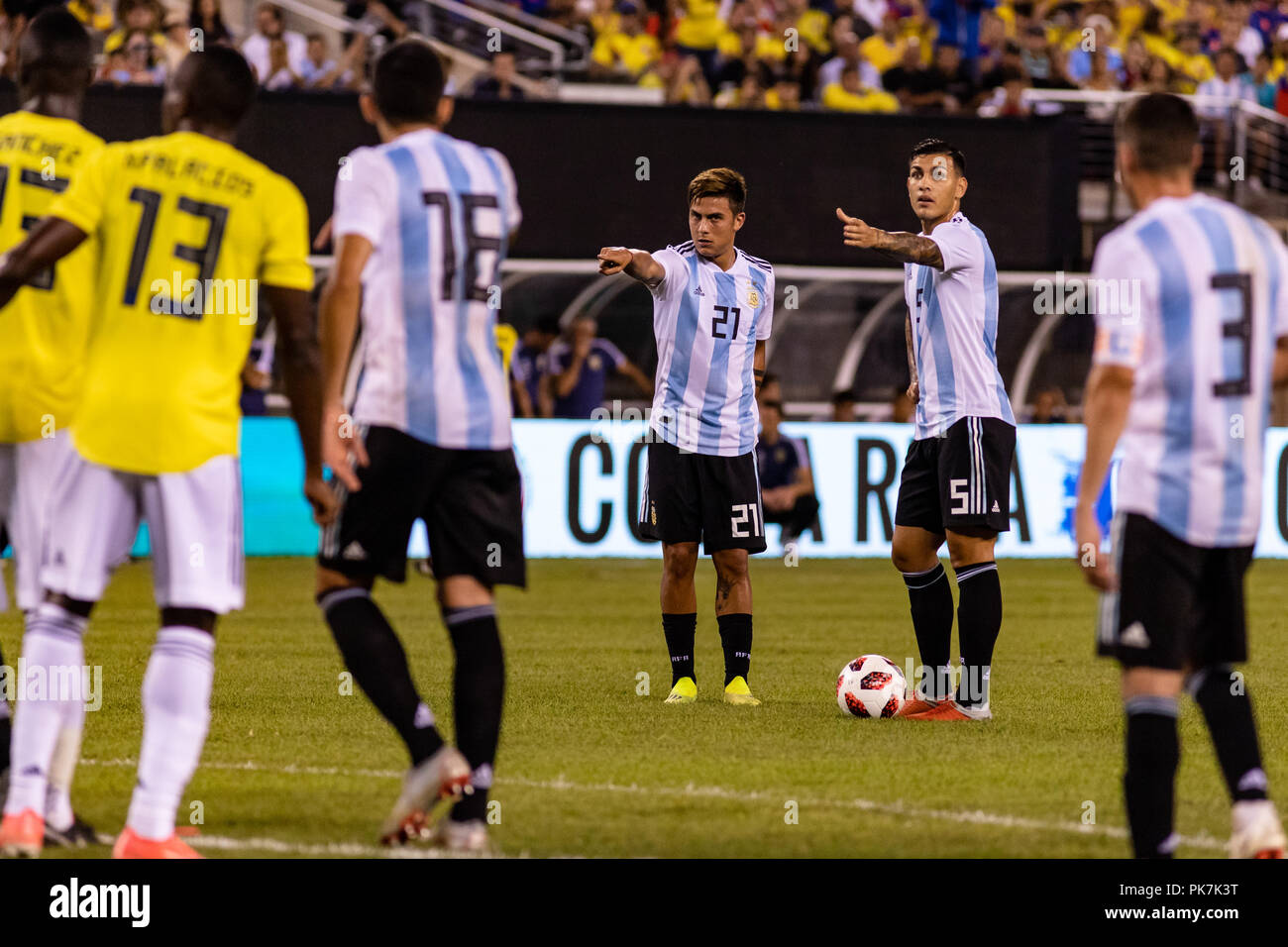 East Rutherford, NJ, USA. 11th Sept, 2018. Paulo Dybala (21) and Leandro Paredes (5) direct traffic ahead of a free kick just outside the box. © Ben Nichols/Alamy Live News. Stock Photo