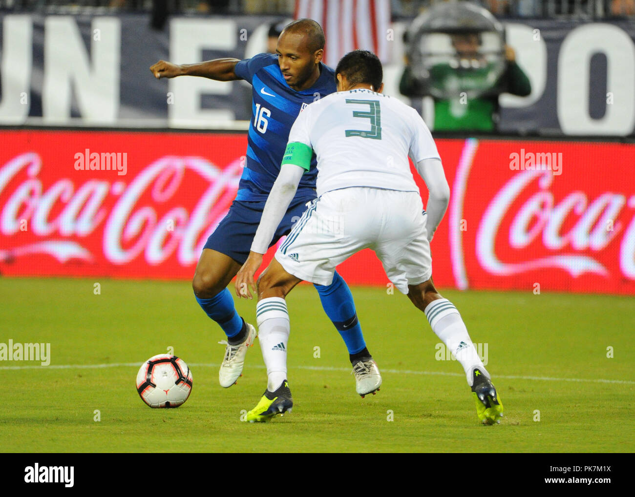 Nashville, TN, USA. 11th Sep, 2018. US midfielder, Julian Green (16), tries to get the ball past Mexico defenseman, Hugo Ayala (3), during the International Friendly match between Mexico and USA at Nissan Stadium in Nashville, TN. The US National team defeated Mexico, 1-0. Kevin Langley/CSM/Alamy Live News Stock Photo