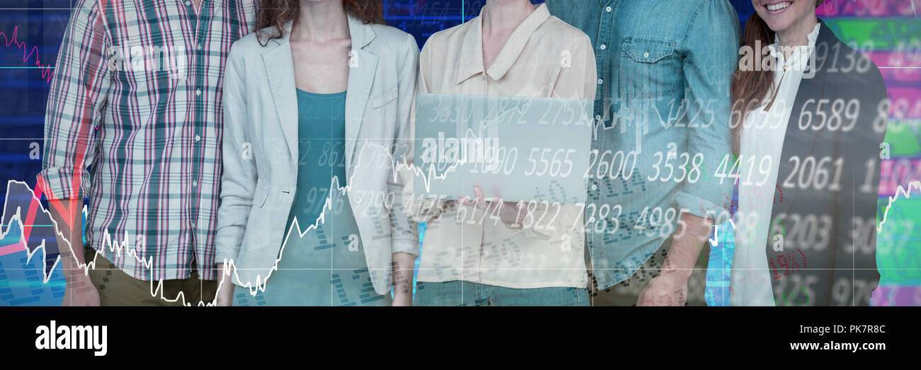 Composite image of businesswoman holding laptop while standing with colleagues against white backgro Stock Photo