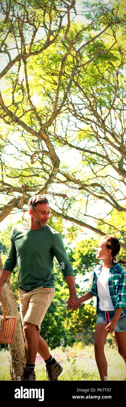 Family arriving in the park for picnic Stock Photo - Alamy