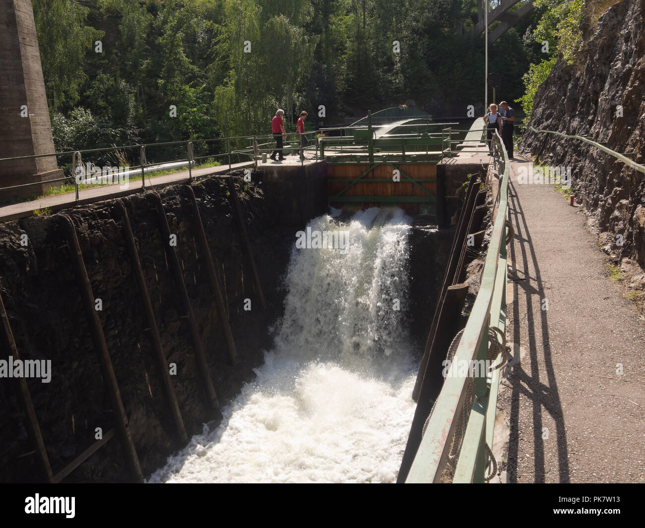 Håverud in Dalsland province Sweden,where the tourist attraction Dalslands canal passes through locks and an aqueduct, cascading water and tourists Stock Photo