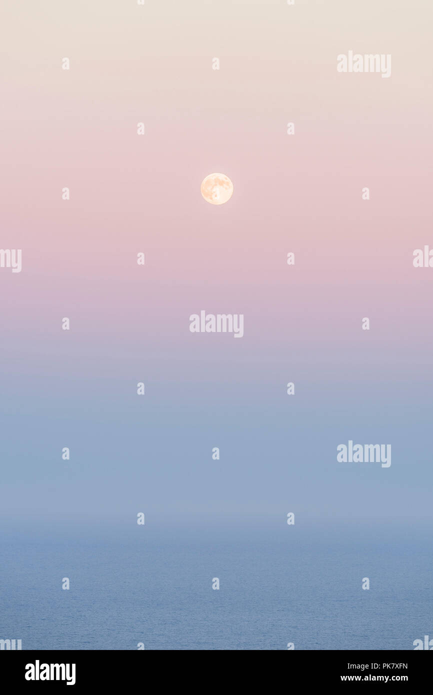 Stunning moonrise through the last colours of a summer sunset. Taken at ...