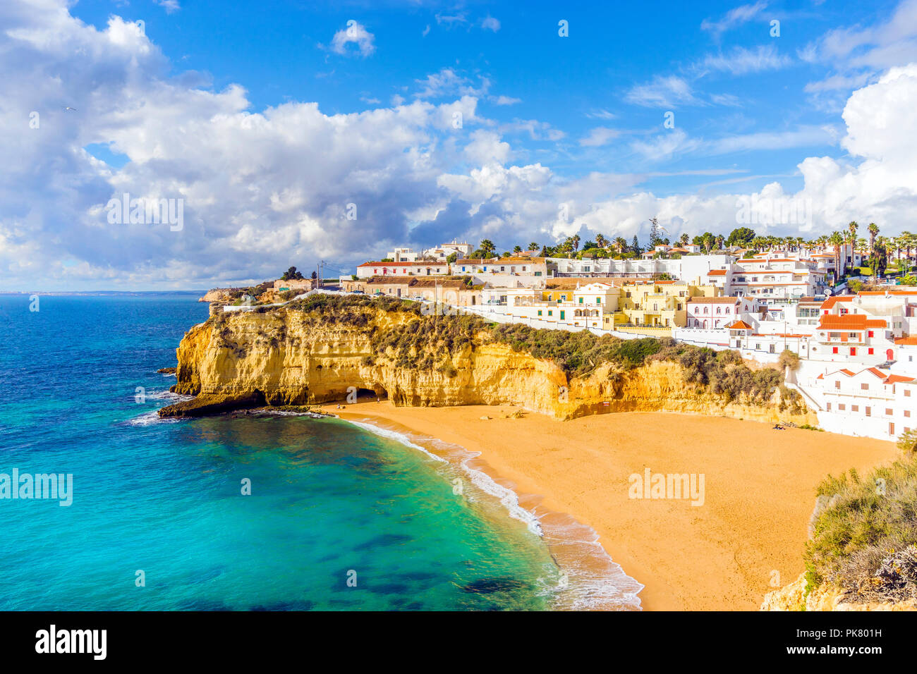 Wide sandy beach and white architecture of charming Carvoeiro, Algarve, Portugal Stock Photo