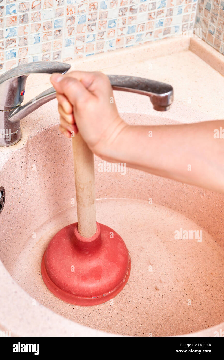 Sink plunger woman hi-res stock photography and images - Alamy