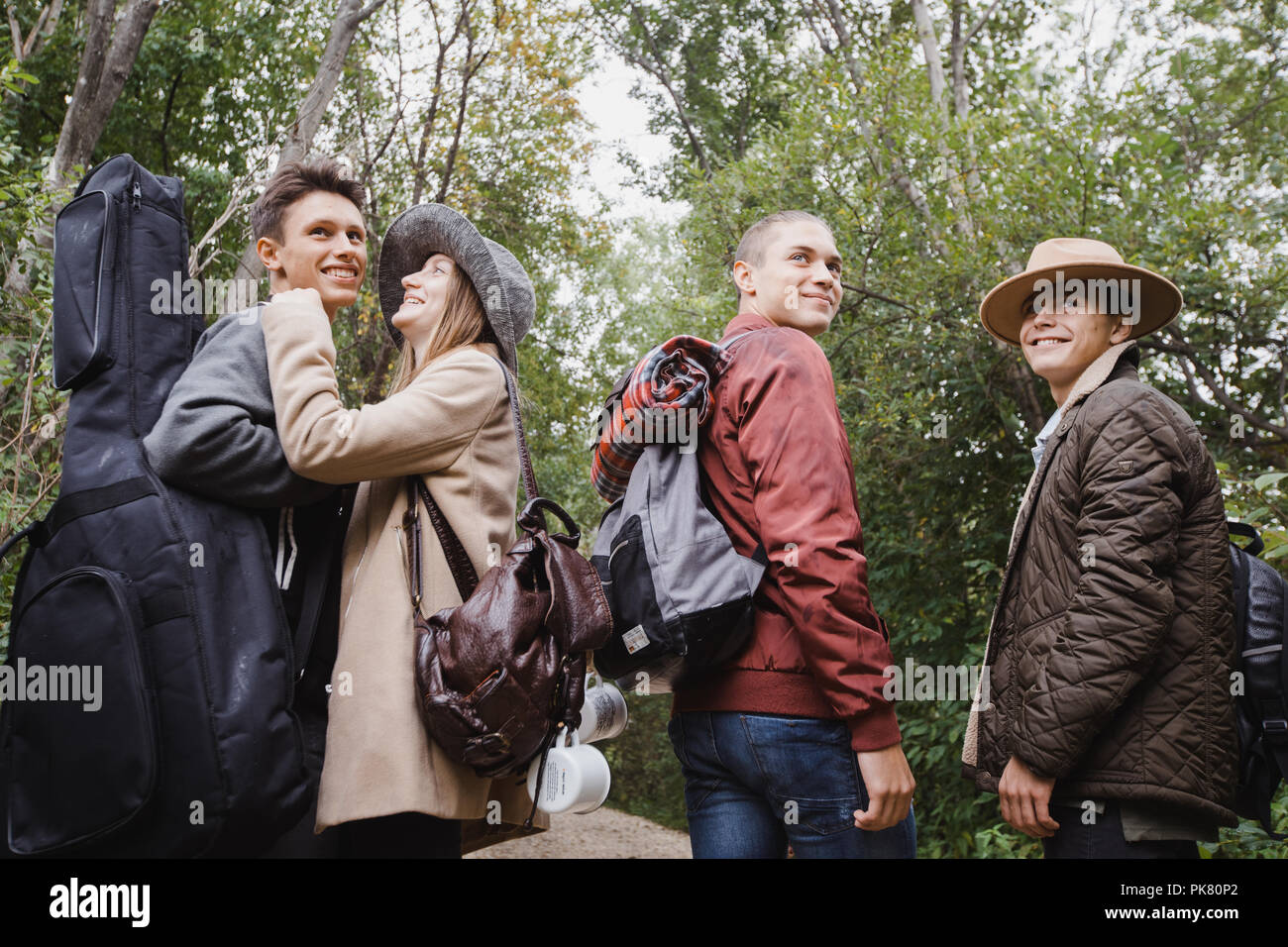 Group of young people standing in forest Stock Photo