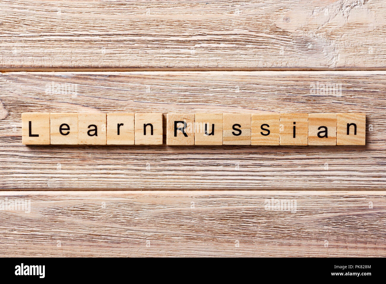 learn russian word written on wood block. learn russian text on table