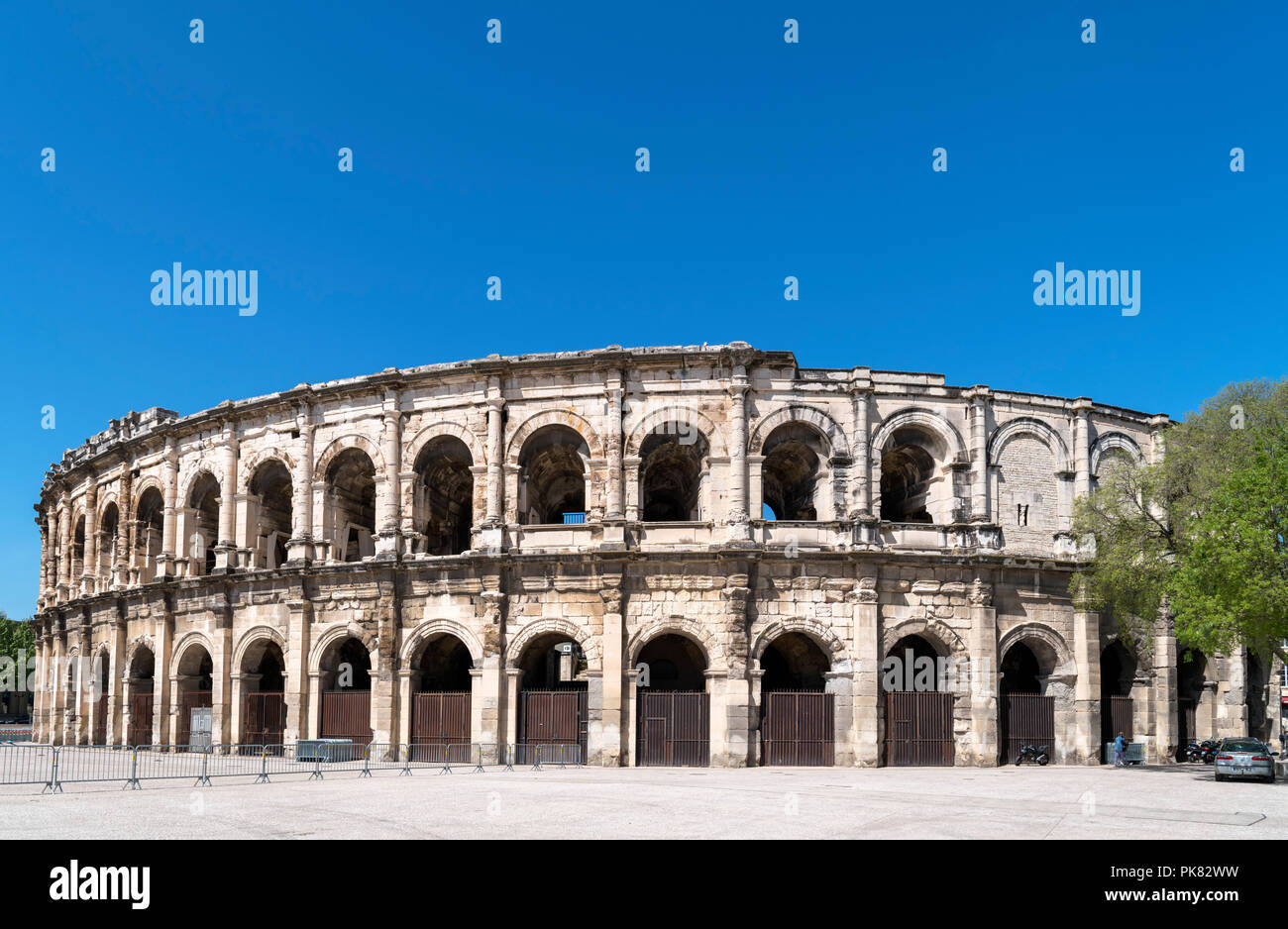 Les Arenes, the 1st century Roman amphitheatre in the city centre, Nimes, Languedoc, France Stock Photo
