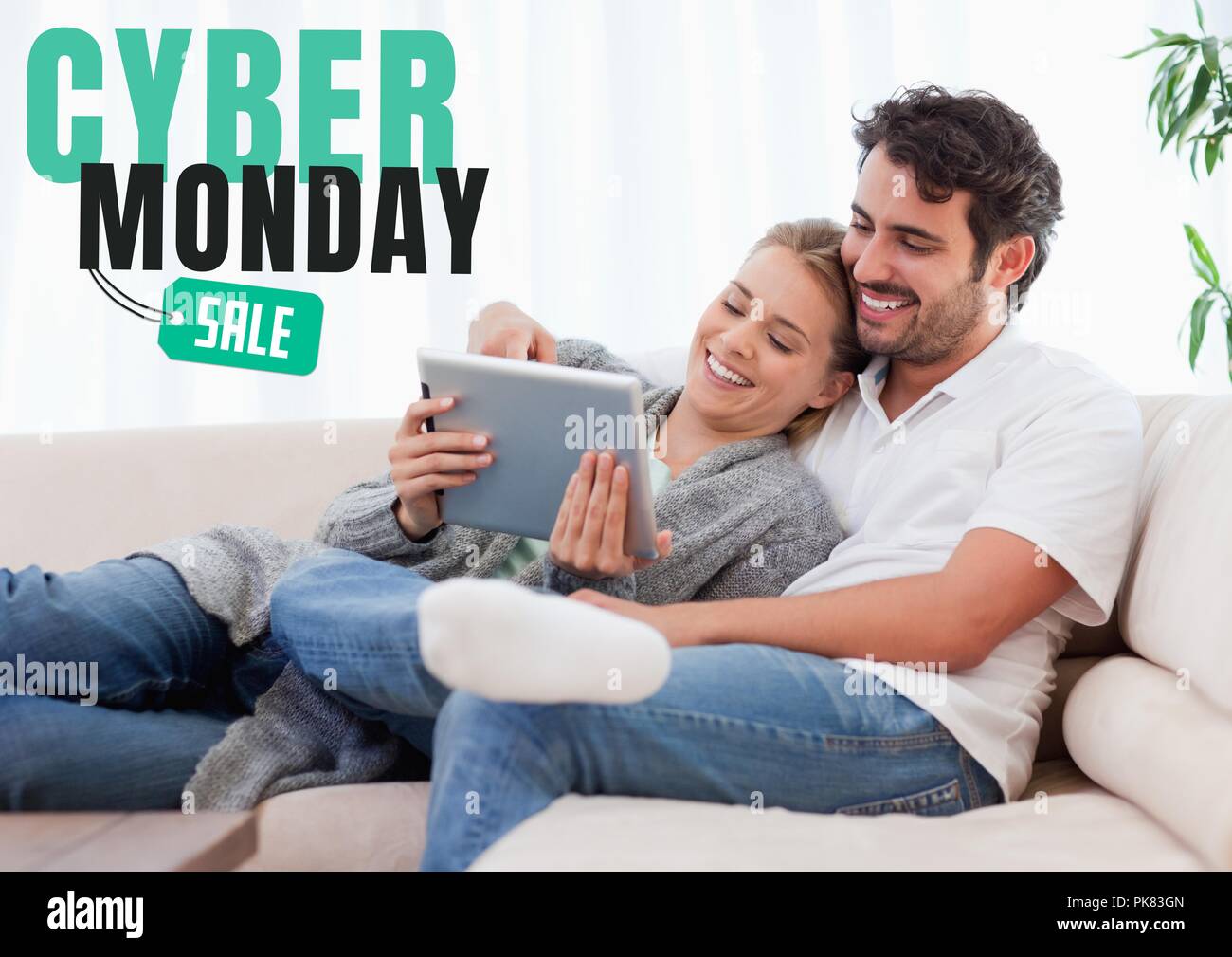 Cyber Monday Sale Man And Woman Sitting On A Couch With Their
