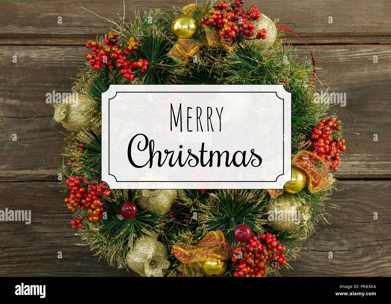 Merry Christmas text with wreath Stock Photo