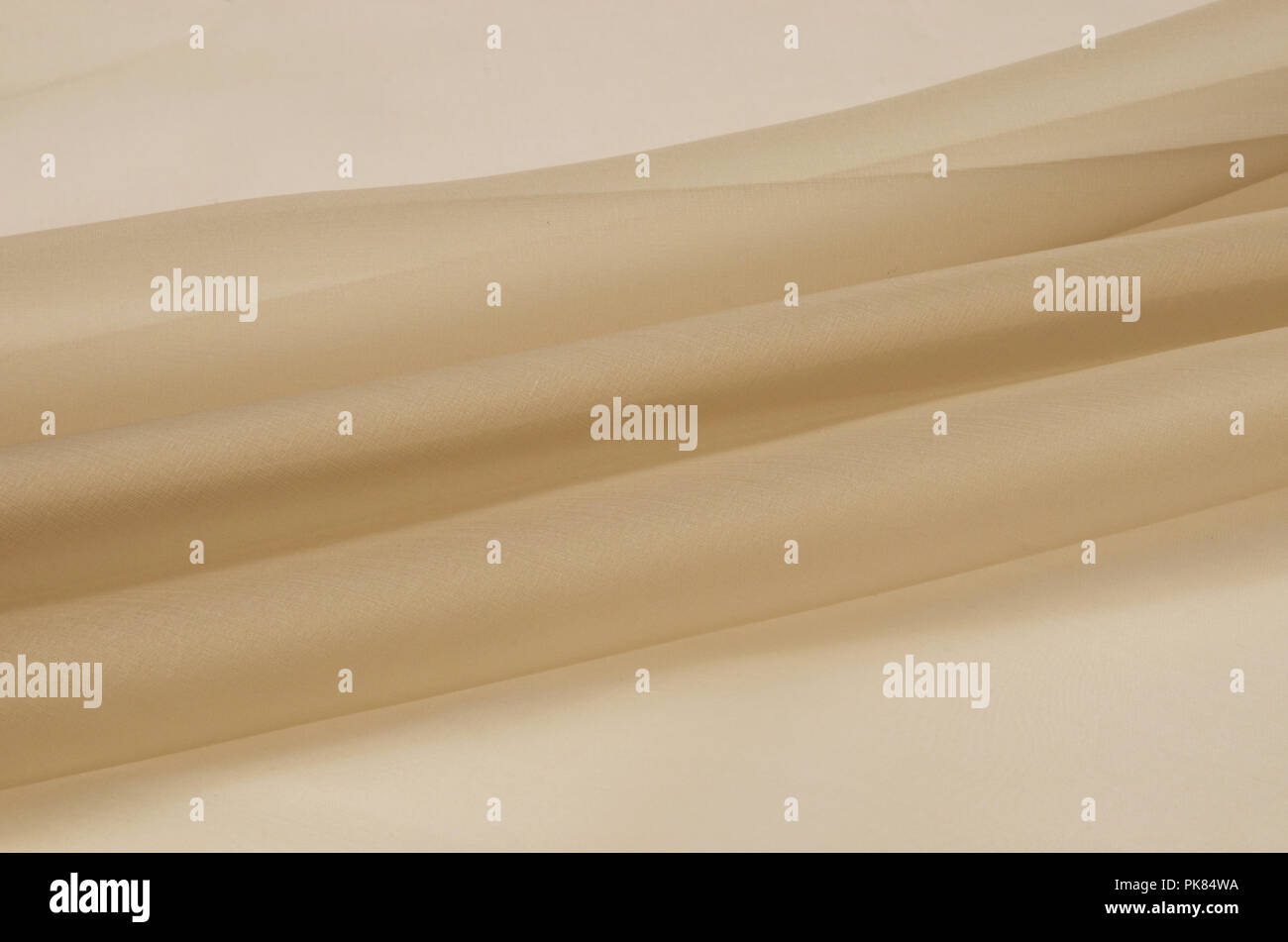 Silk fabric, beige organza. Stock Photo