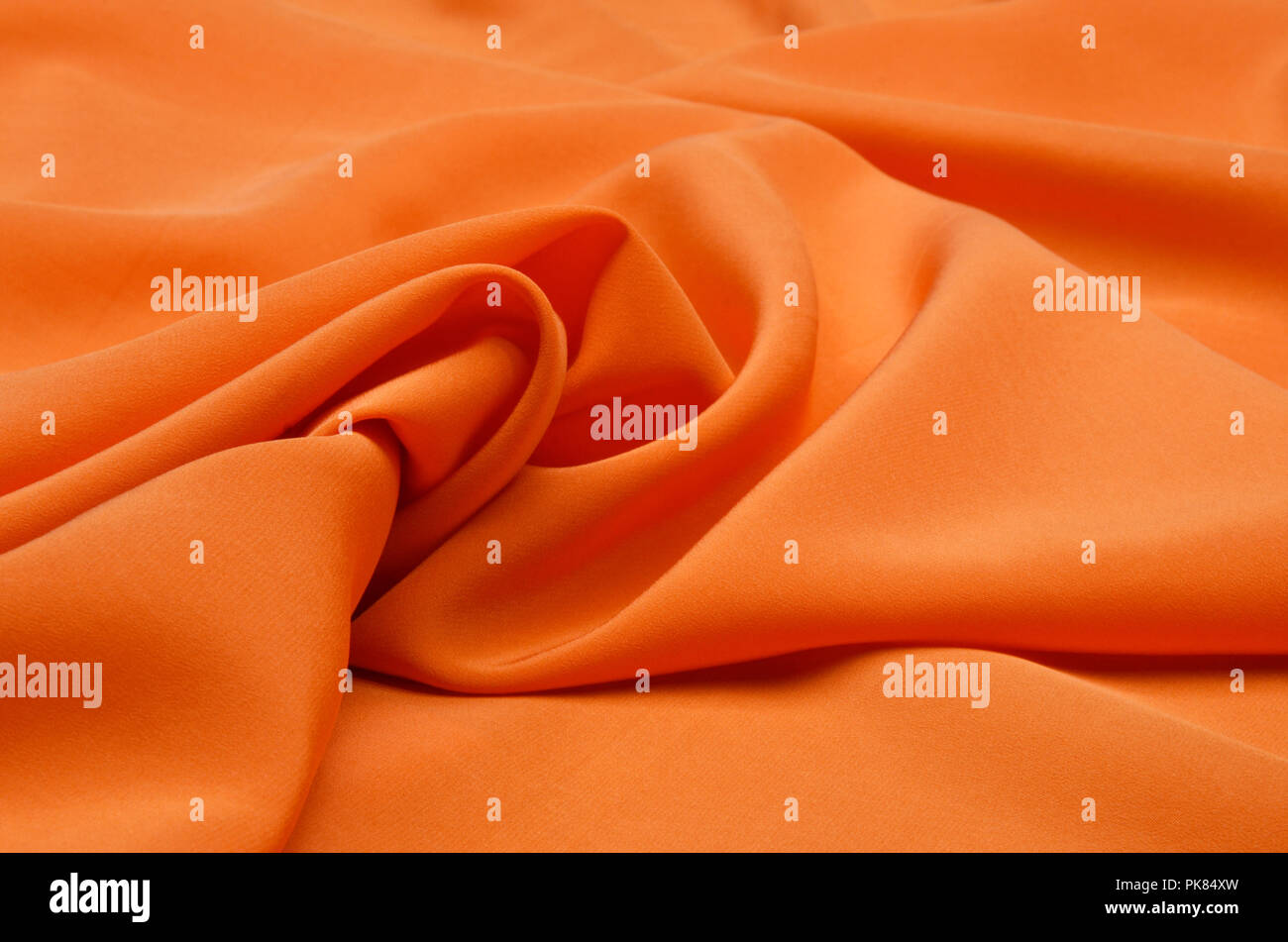 Silk fabrics of crepe de Chine orange Stock Photo Alamy
