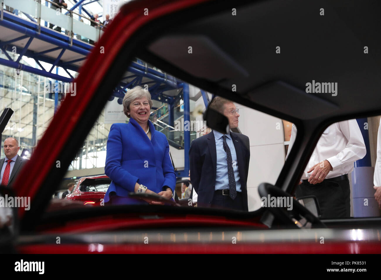 Prime Minister Theresa May and Mayor of the West Midlands' Andy Street, during the Zero Emission Vehicle Summit at the ICC in Birmingham. Stock Photo