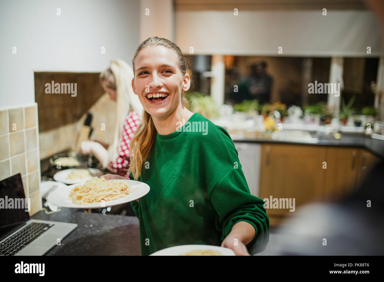 Woman serving food party hires stock photography and images Alamy