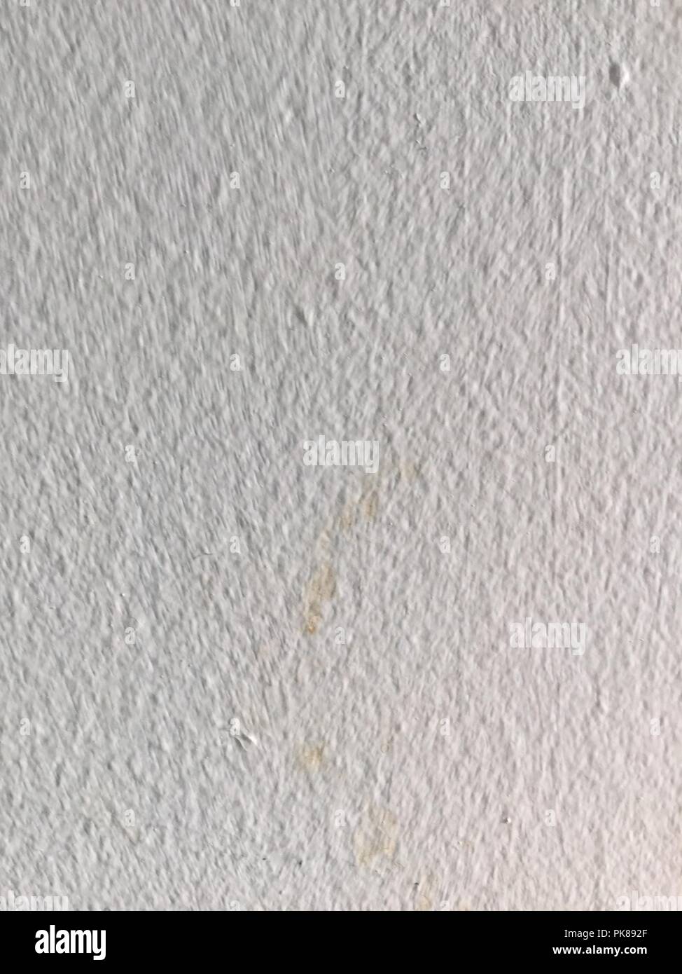 Textured white painted wall with textures. Stock Photo