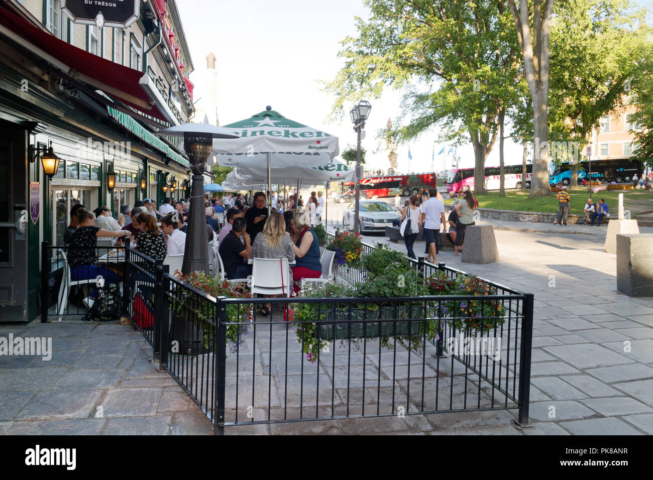 People eating on the busy tourist restaurant terrasses on Rue Ste Anne in Vieux Quebec, Canada Stock Photo
