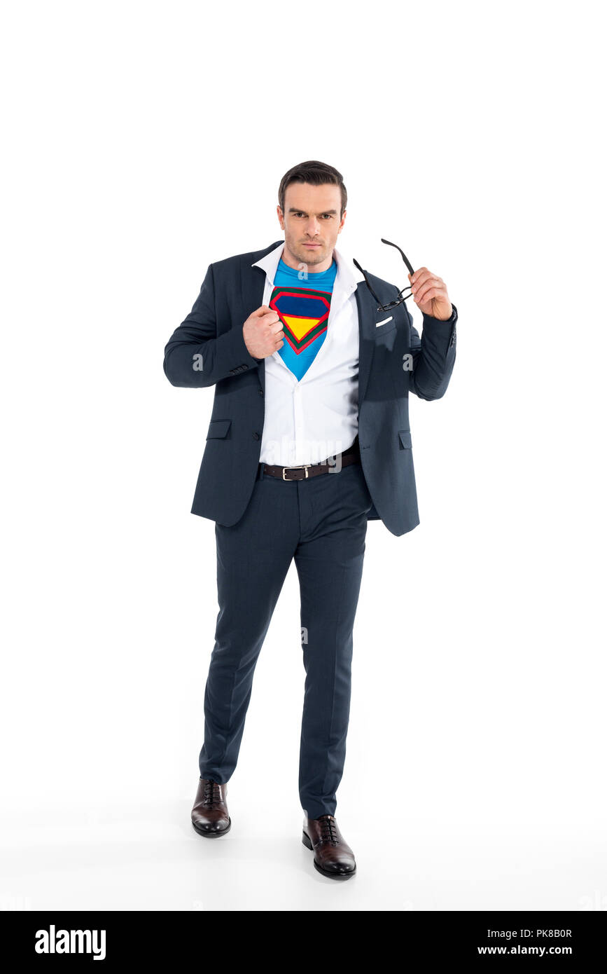confident businessman in superhero costume under suit taking off eyeglasses and looking at camera isolated on white Stock Photo - Alamy confident businessman in superhero costume under suit taking off eyeglasses and looking at camera isolated on white Stock Photo - Alamy