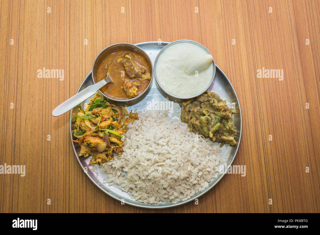 Nepali Style snacks or Khaja Set on the plate with meat,curd,pickle
