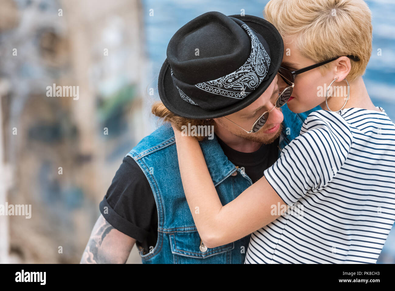 Tattooed Girlfriend Looking At Camera And Hugging Free Stock Photo and  Image 180336794