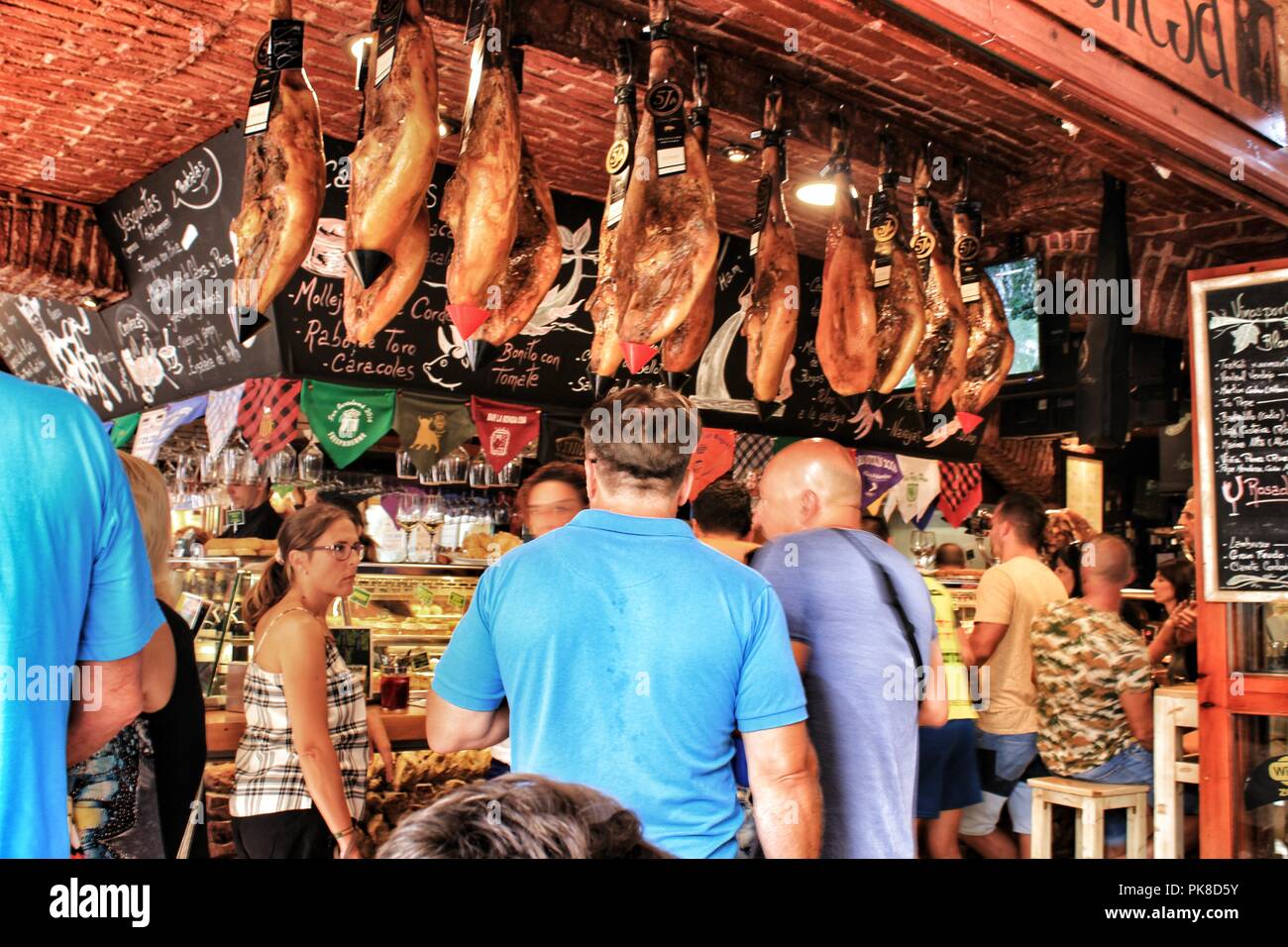 Benidorm, Alicante, Spain- September 8, 2018: Bar of typical spanish food full of people in the old town of Benidorm Stock Photo