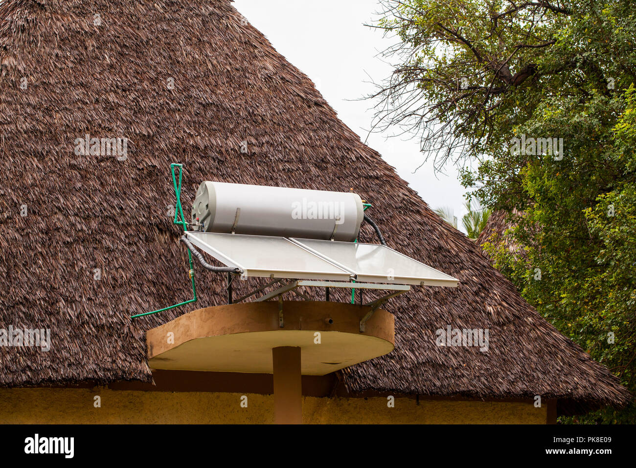 Systems for heating water from sunlight ( sun collectors) on roofs of hotel in Kenya Stock Photo