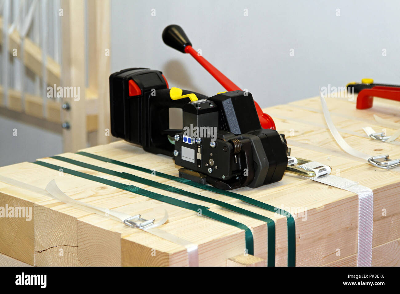 Portable strapping machine for packing crates and boxes Stock Photo