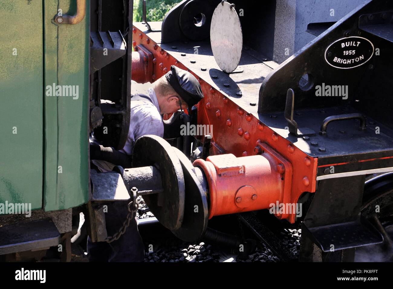 Corfe, England June 03 2018 Train driver uncoupling the engine from