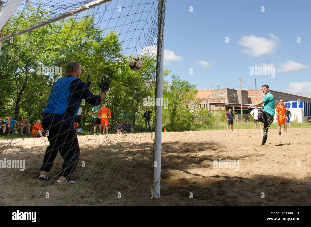 Komsomolsk-on-Amur, Russia - August 8, 2016. Public open Railroader's day. football player is on goal in amateur beach soccer championship Stock Photo