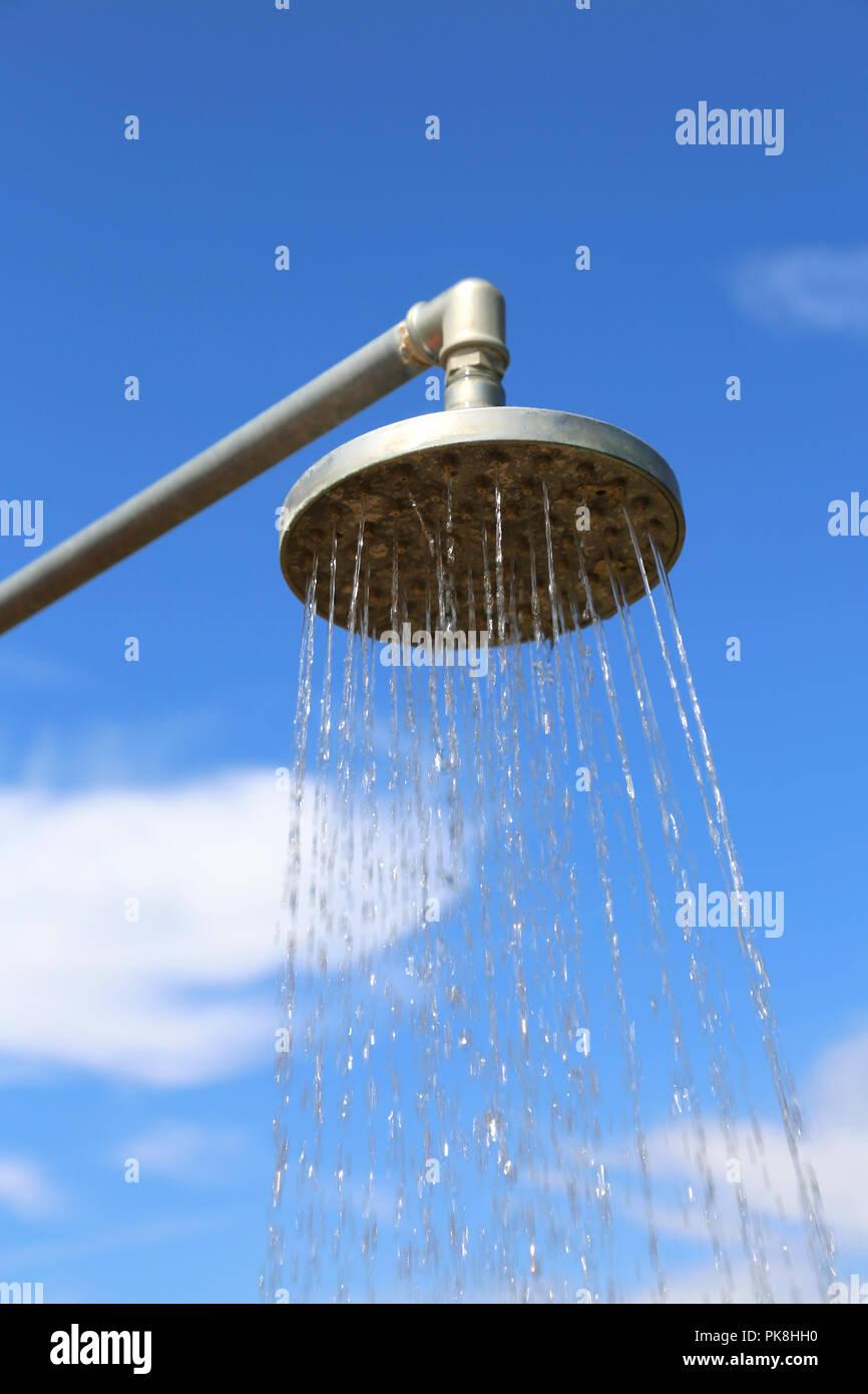 big shower with water to wash outdoors and the background of the sky