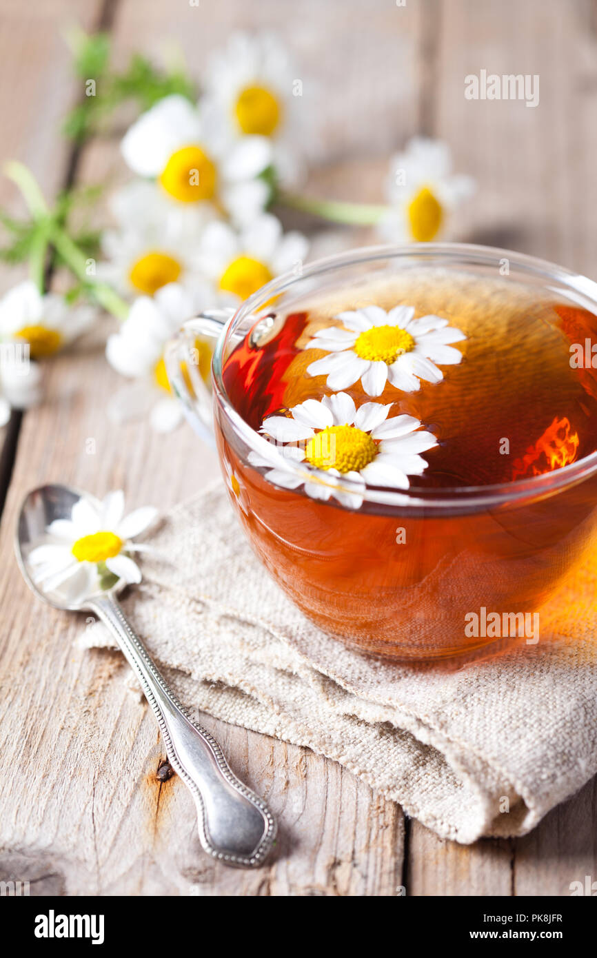 cup of tea with chamomile flowers on rustic wooden background Stock ...