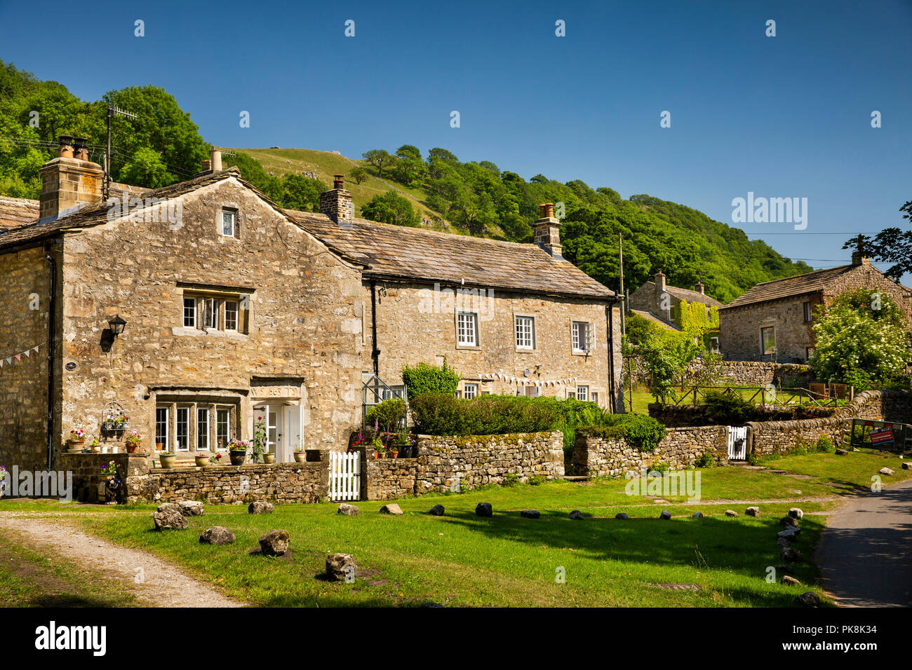 UK; Yorkshire; Wharfedale; Starbotton; attractive 1663 stone built farmhouse below Cam Gill Beck Stock Photo