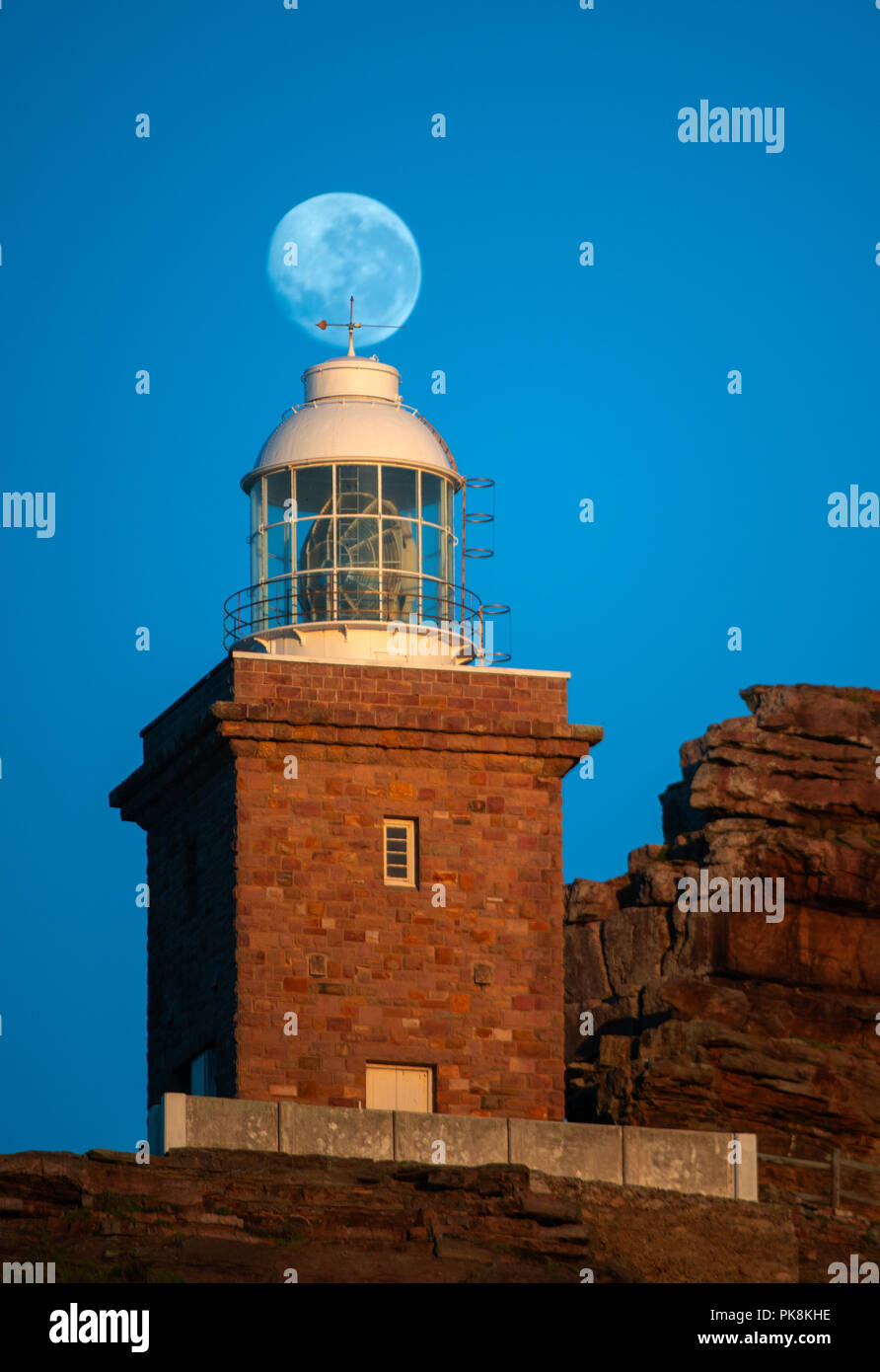 Lighthouse Cape of Good hope and moon in blue sky. South Africa. Stock Photo