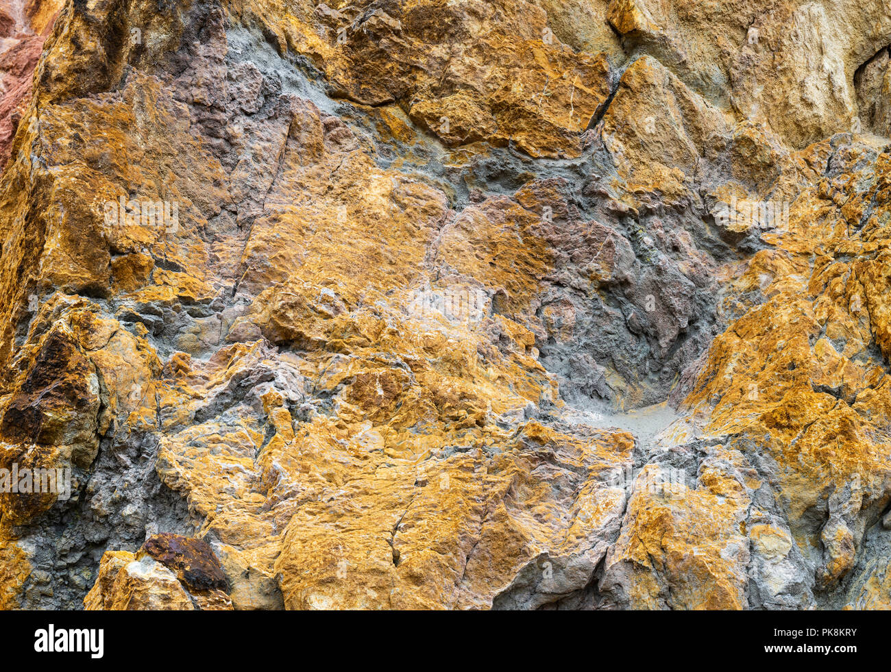 Copper ore deposits in rocks at Parys Mountain Copper Mine, Anglesey