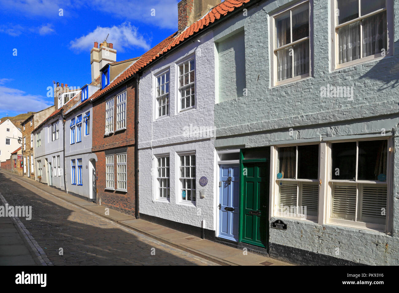 Holiday cottages on cobbled Henrietta Street, Whitby, North Yorkshire