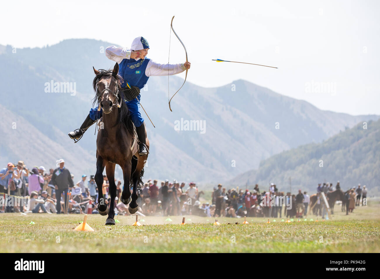 CholponAta city, Kyrgyzstan Sep 6, 2018 Female archer aiming at a