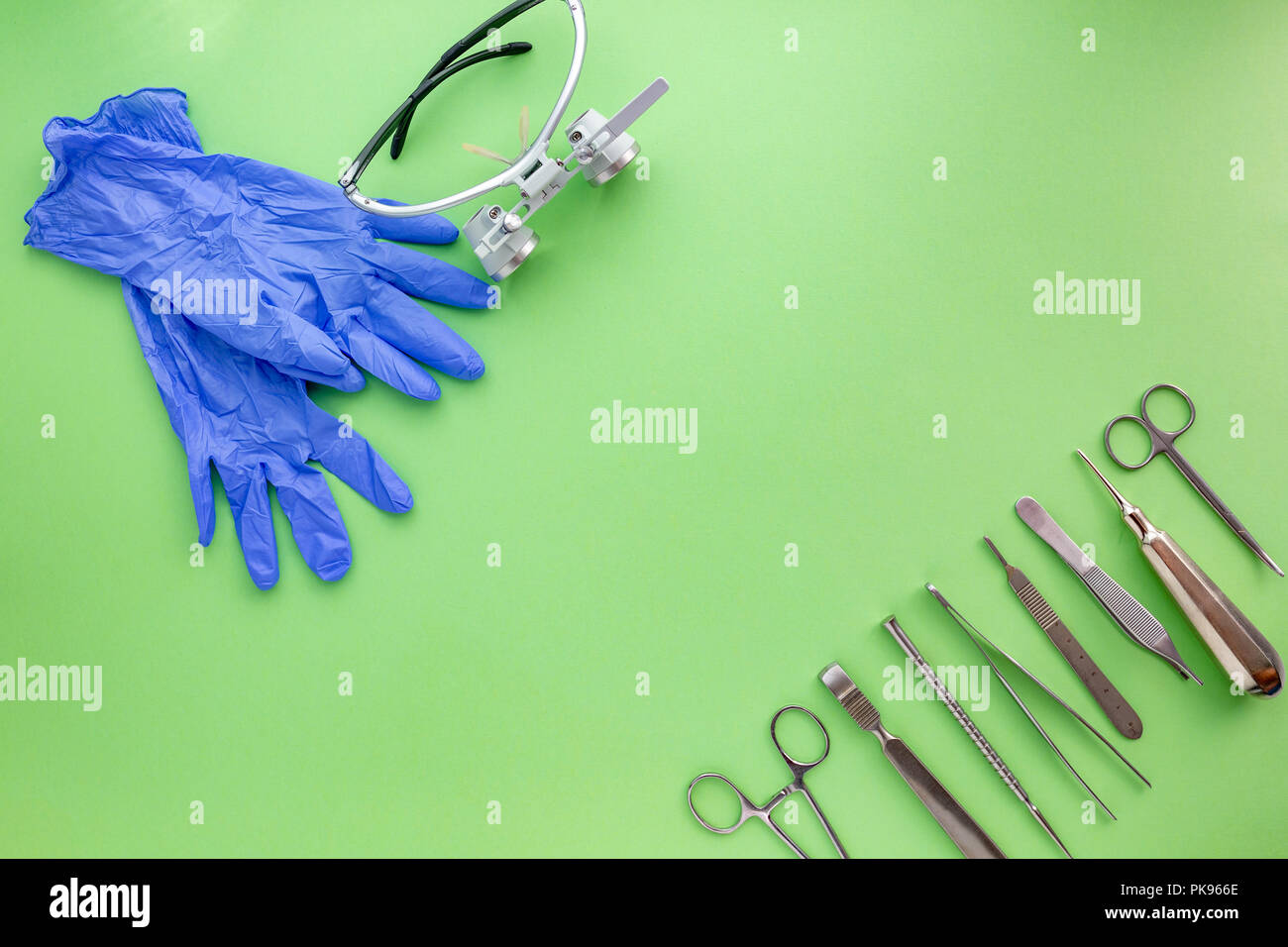 Medical equipments including surgical instruments on a green background