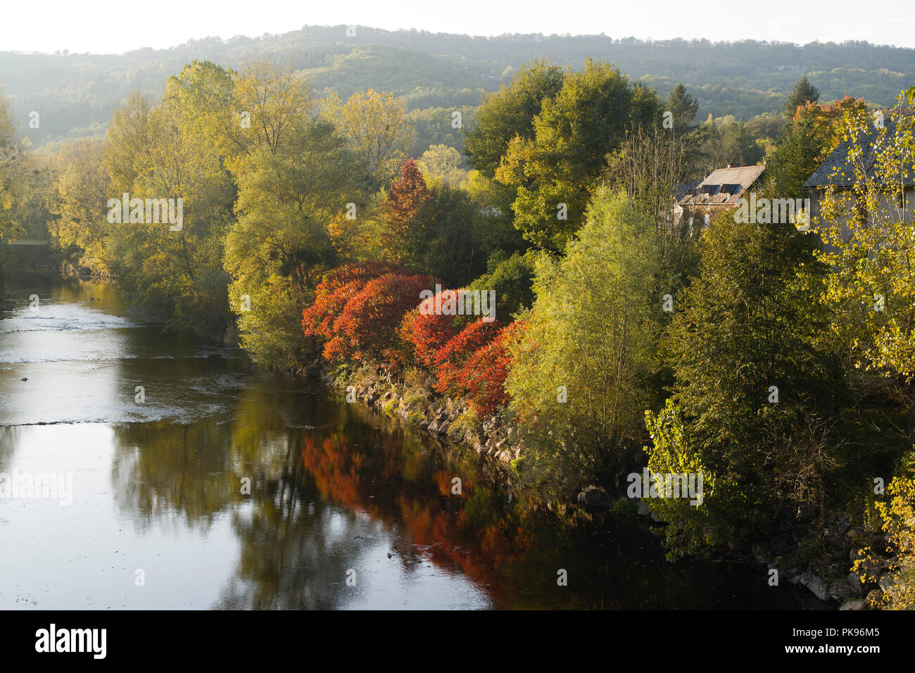 The River Aveyron at the mediaeval village of Najac, Aveyron, Occitanie, France, Europe in the autumn sunshine Stock Photo